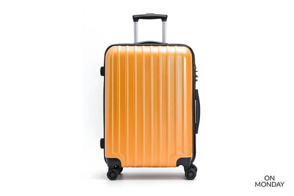 Oranssi lentolaukku renkailla ja vetokahvalla